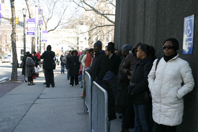 Parents waiting for their turn to enter the Harlem Education Fair.