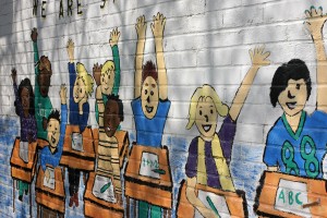 A mural that greets students and visitors to P.S. 46. Photo: Kyla Calvert/COVERING EDUCATION